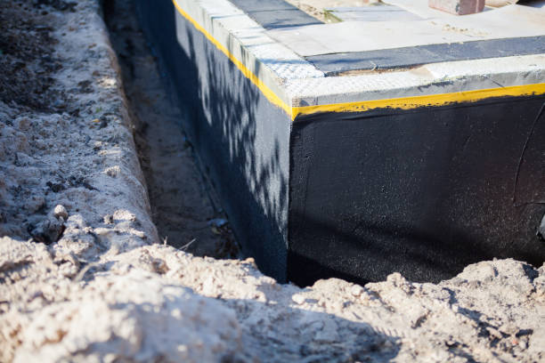 Professional Waterproofing technician working in Rockville, MD